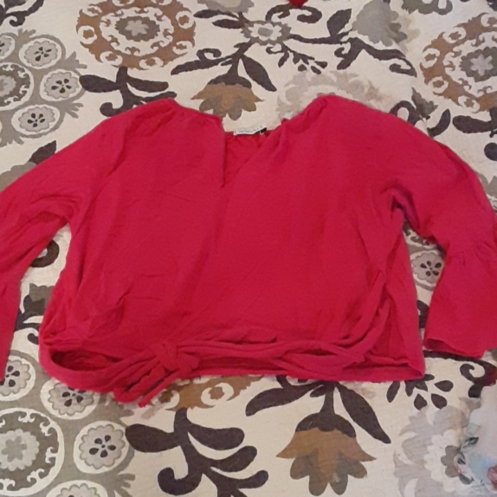Pink shirt that ties around the back